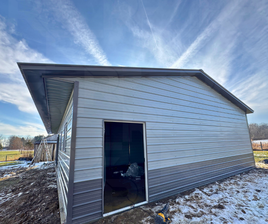 Front corner of 30×50 metal workshop with vertical roof in Johnstown