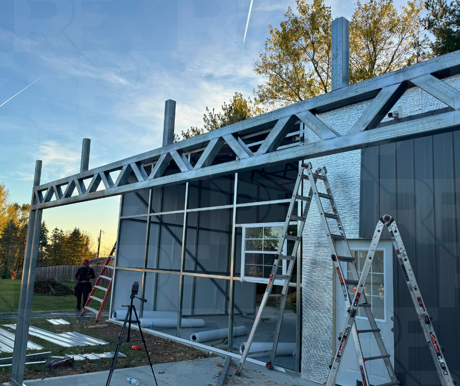 Custom steel garage and covered porch designed for storage and outdoor living in Bellefontaine, Ohio.
