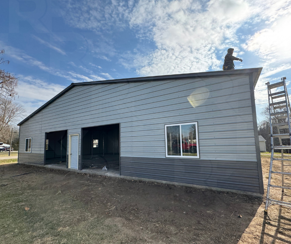 30×35×14 metal workshop with dual enclosed lean-tos and vertical roofing.