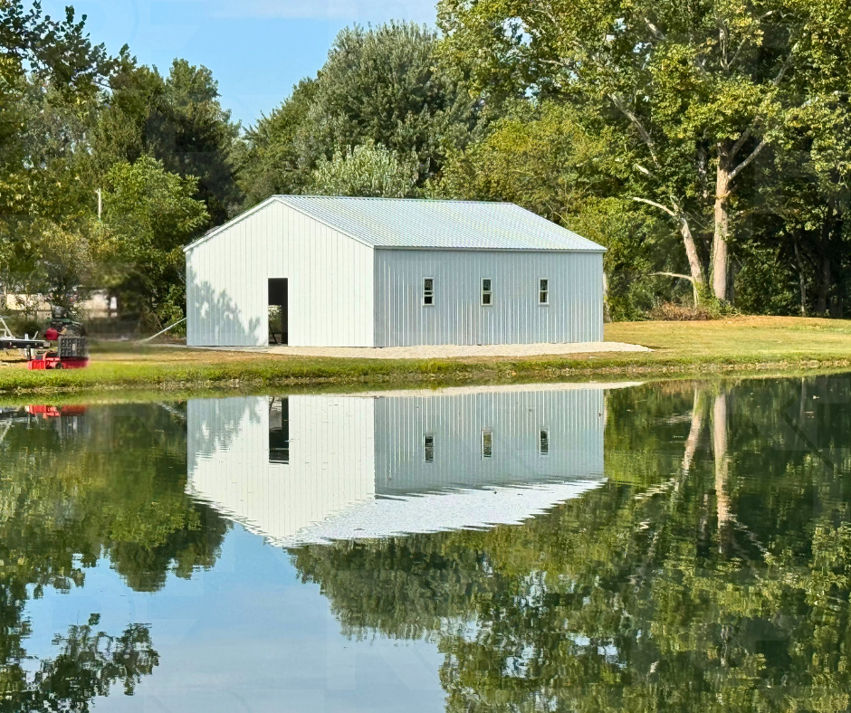 Side view of custom 26×40×10 steel garage with three windows in Dayton