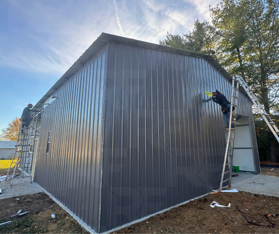 Steel building with integrated porch roof and residential entry door.