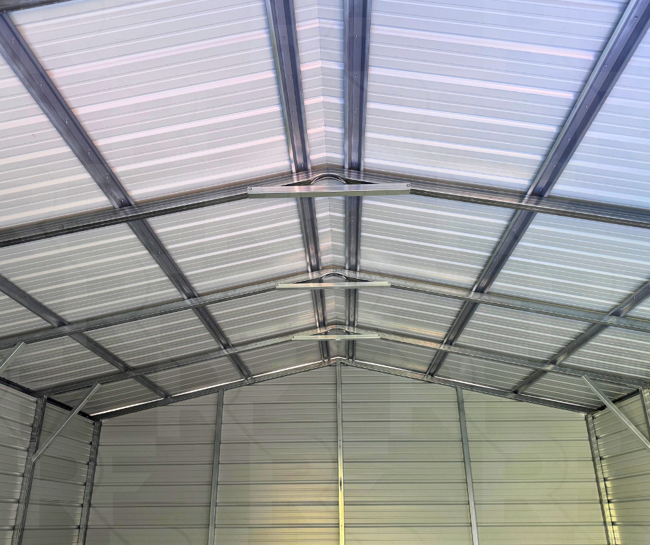 Vertical metal roof with color-matched screws and white trim on a custom garage