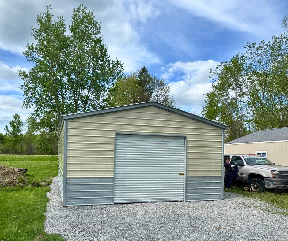 18x20 Gray and Beige steel building installed on gravel.