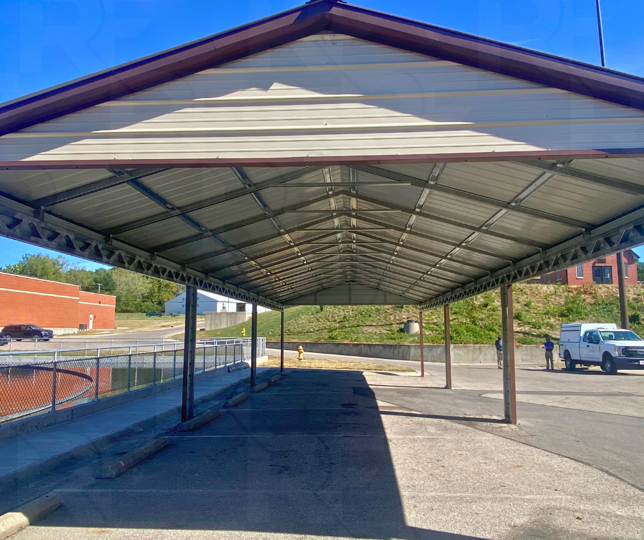 Open steel parking shelter with full vertical roof in Hilliard, Ohio.