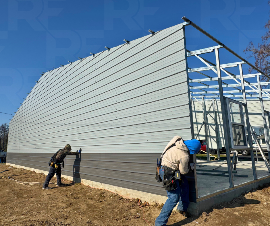 Custom equipment storage building with enclosed side wings and open center workspace.