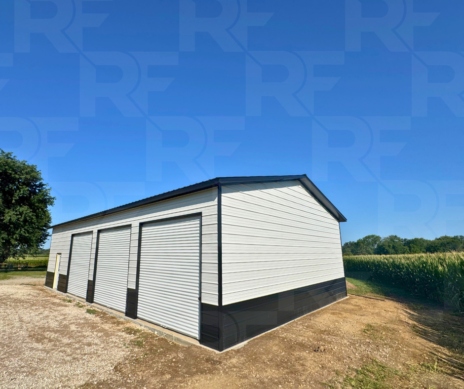 Three-bay metal garage with full one-foot roof overhang