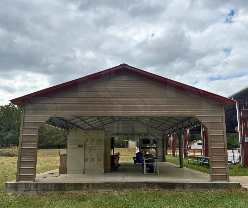 Covered metal structure with concrete floor and outdoor seating