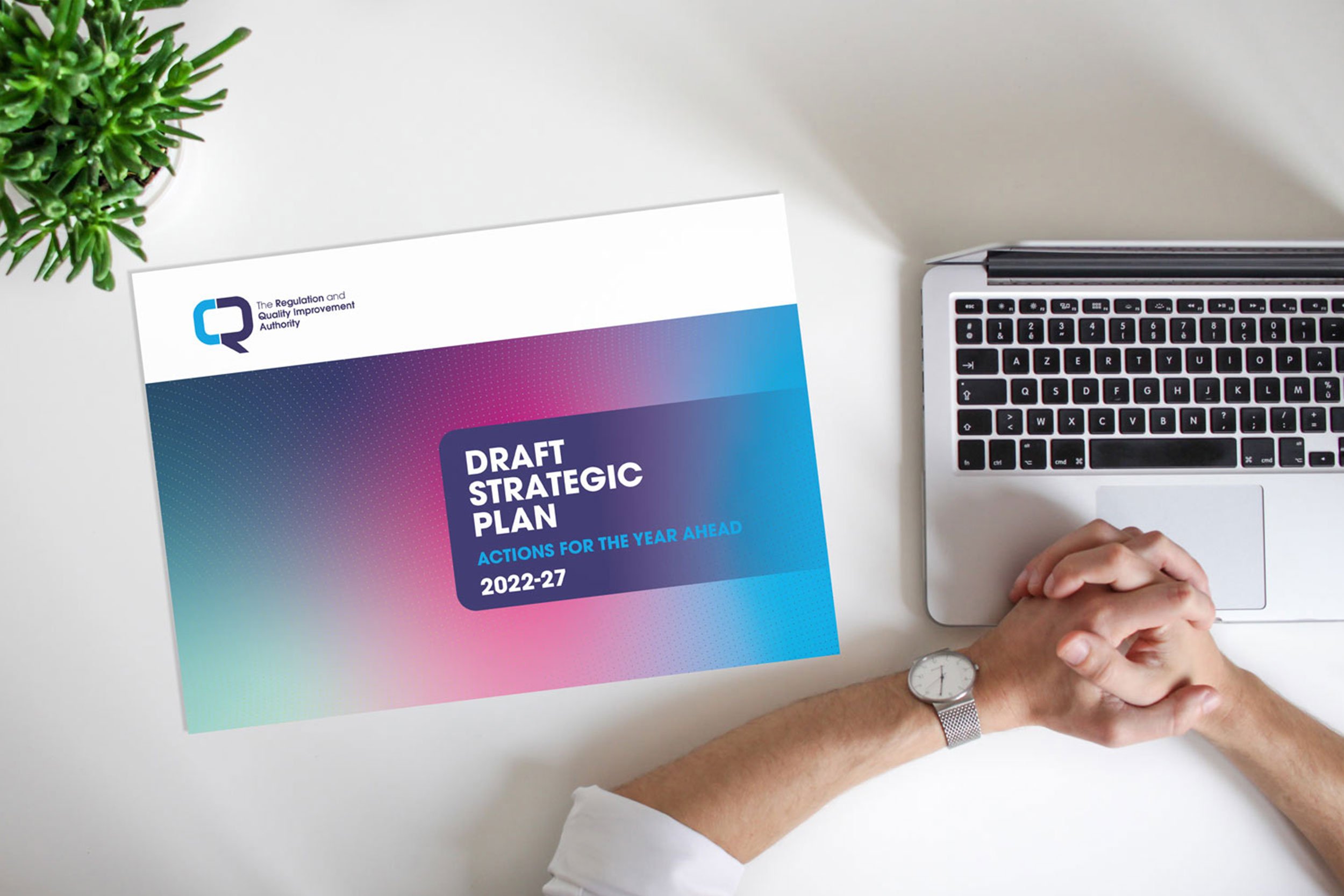 Image showing RQIA consultation document beside a computer