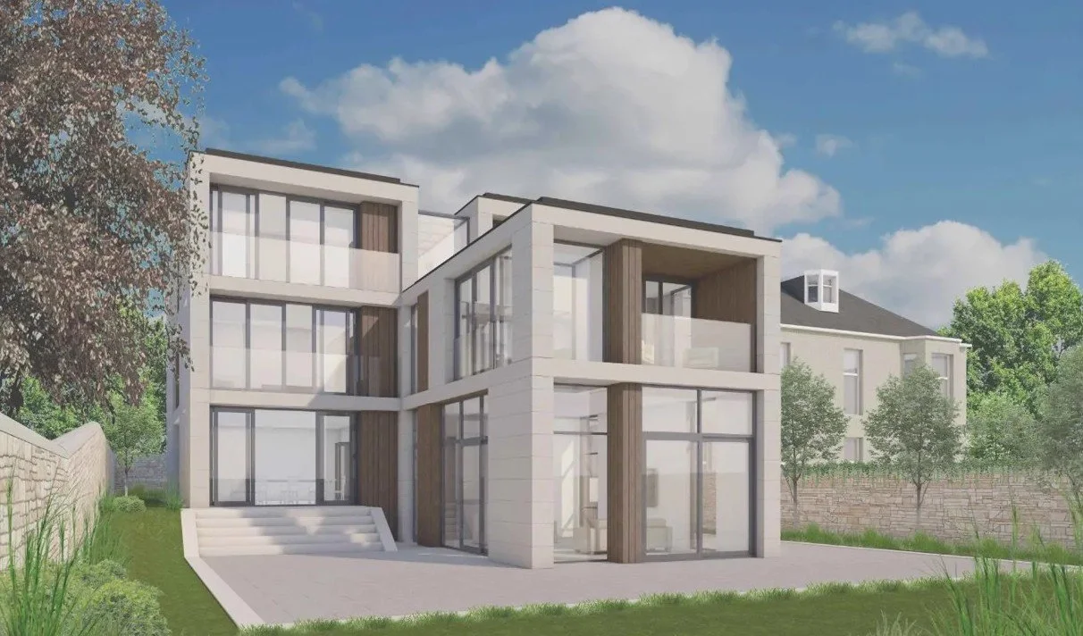 A modern multi-story house with large glass windows and white exterior, surrounded by greenery and set against a partly cloudy sky.