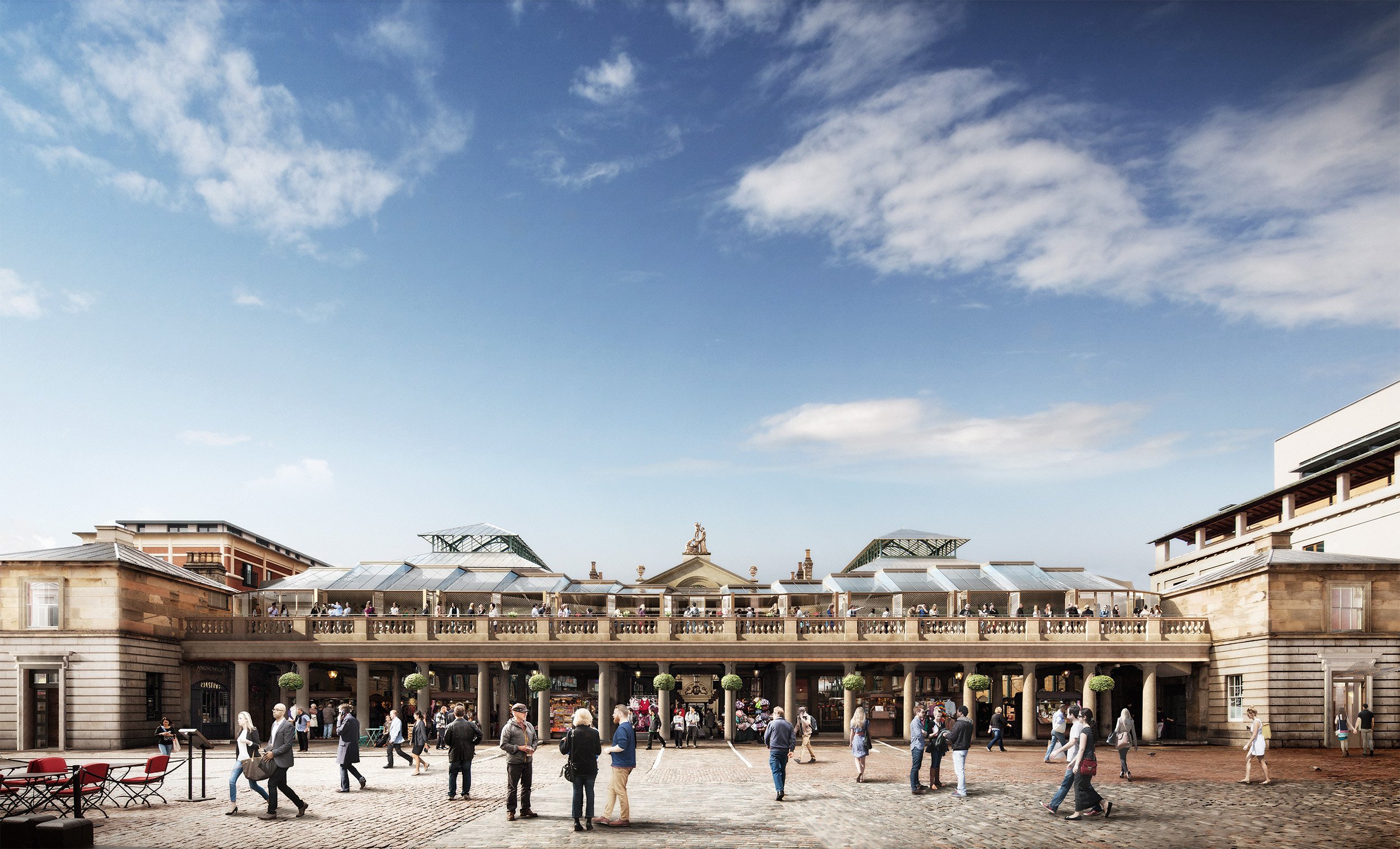 People walking and standing in a busy outdoor square in front of a historic building with a balcony and glass-roofed structures on top, under a partly cloudy sky.