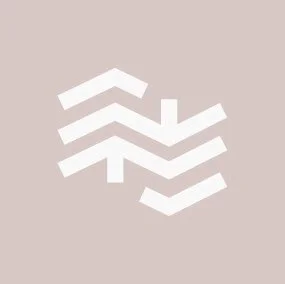 Abstract geometric design with white chevron shapes on a beige background.