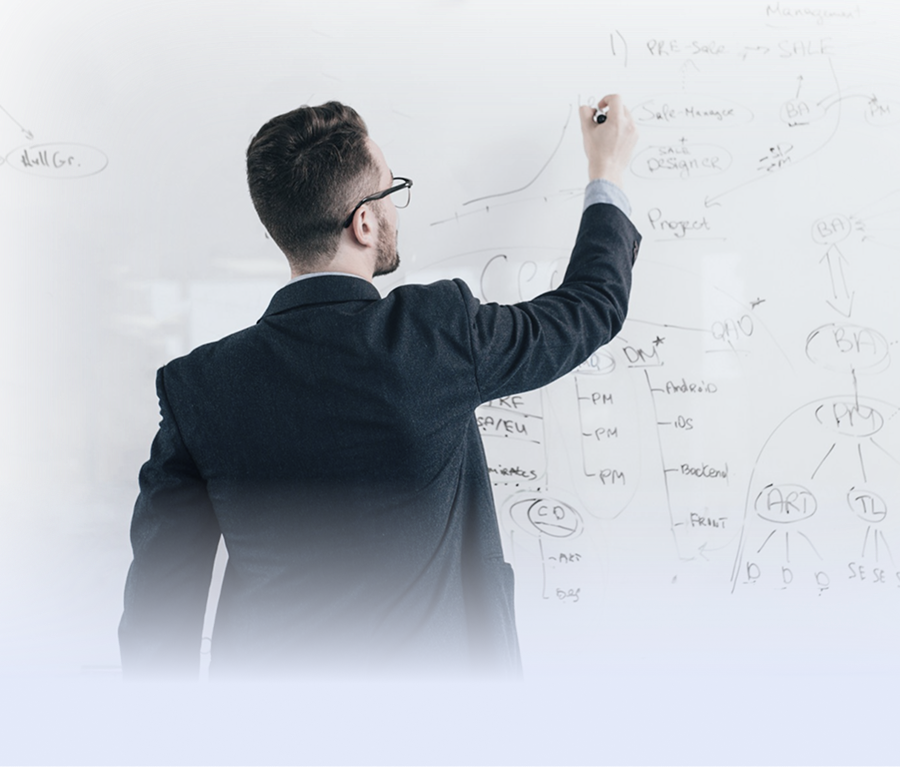 A person writing on a whiteboard