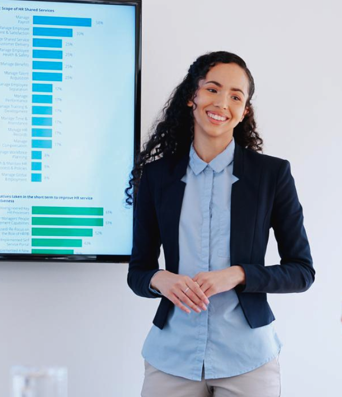 A person in front of a presentation