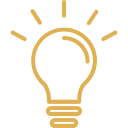 Icon of a glowing light bulb with rays radiating outward.