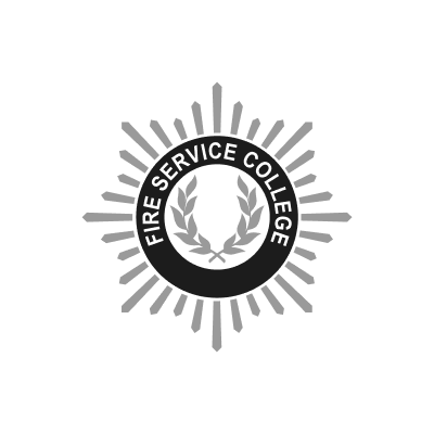 Fire Service College logo with a laurel wreath, circle, and radiating lines.