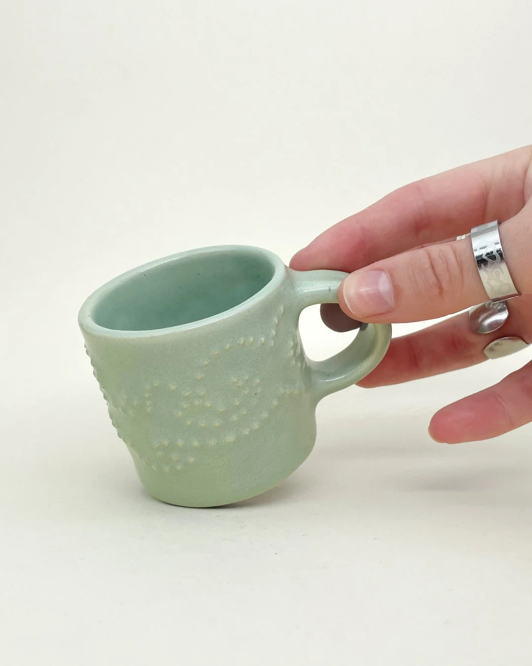 Mint Floral Espresso Mug, ceramic, mint glaze, decoration saves , hand holding