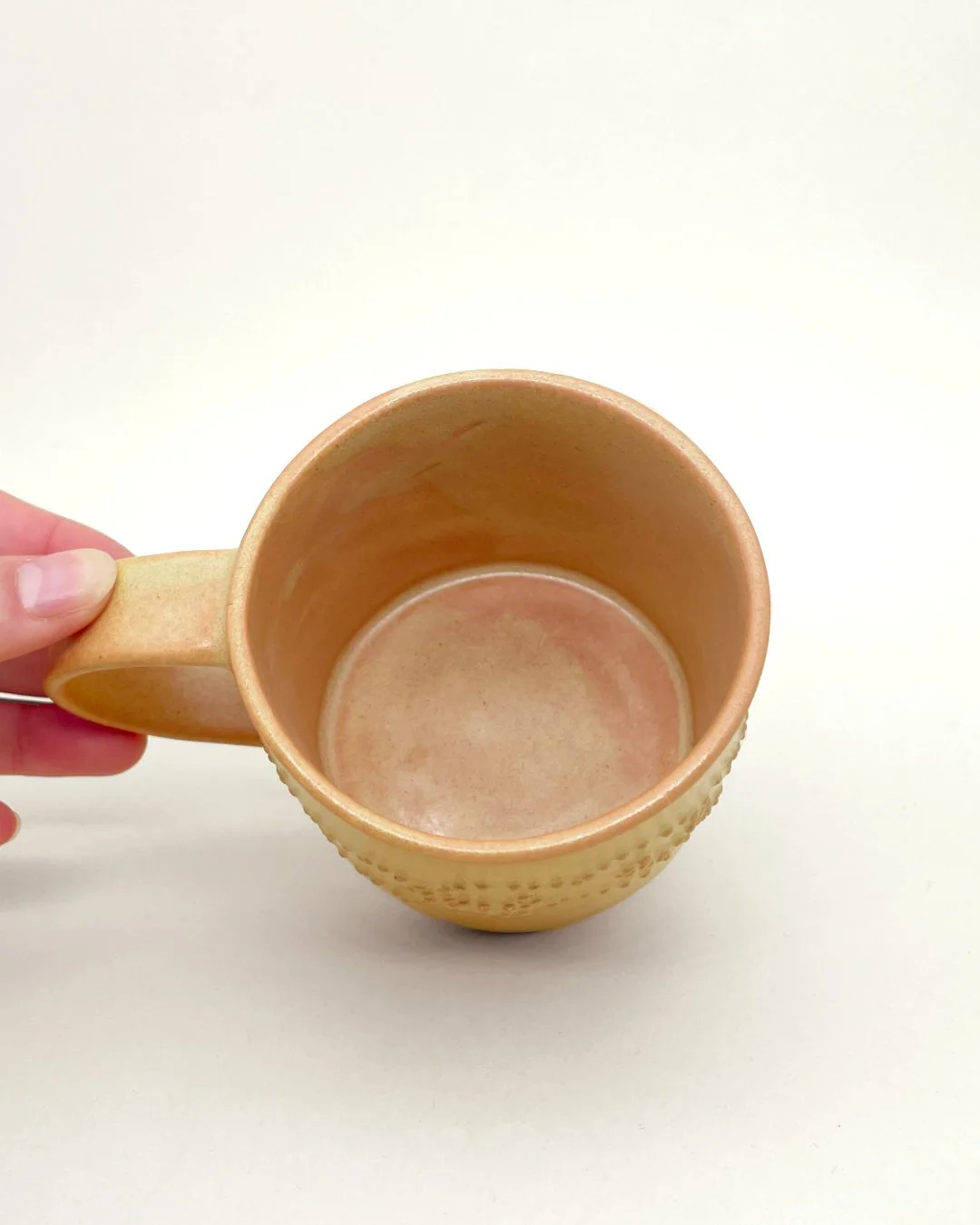Hand Holding, Ceramic Mug, Yellow floral decal, embossed dot detail, Decoration saves