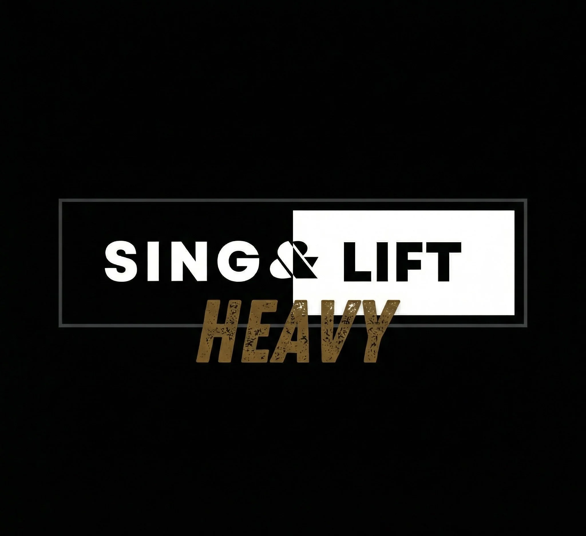 Sign with the text 'Sing & Lift Heavy', with 'Sing &' in white on black background and 'Heavy' in gold, distressed font below.