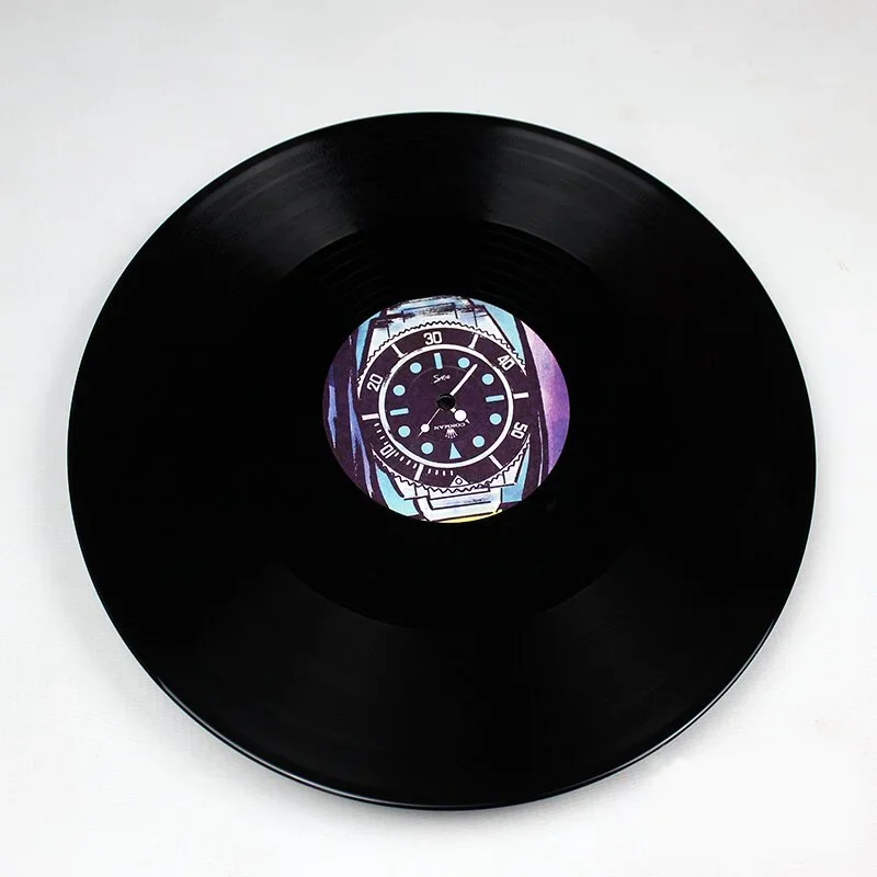 A black vinyl record with a watch face design in the center.