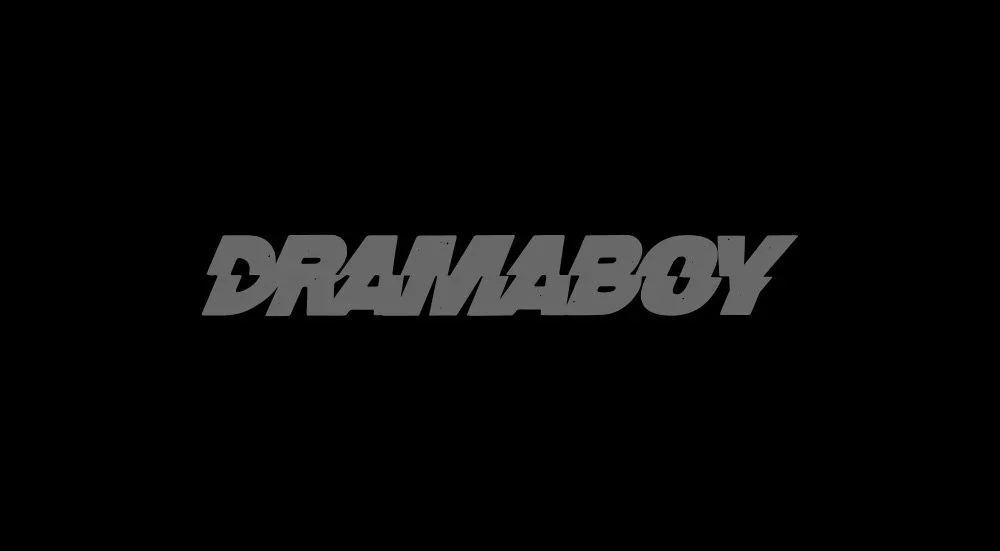 Black background with the word "DREAMABOY" in bold, stylized gray font