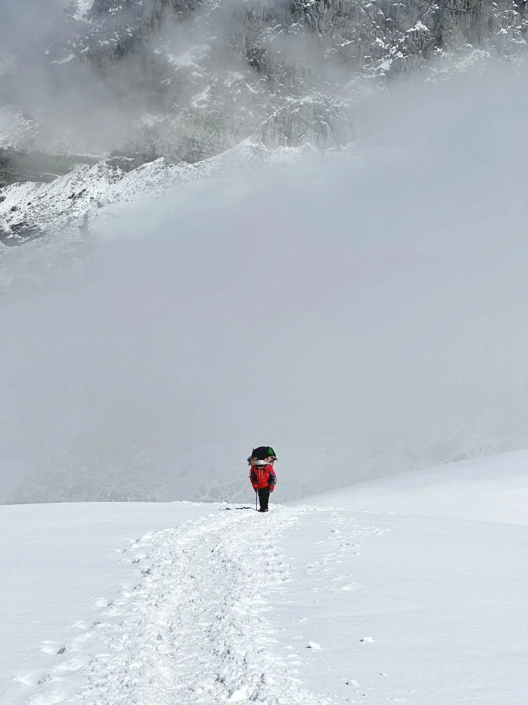 Carrying the mountain so others can climb it &mdash; the porters, the unsung backbone of every expedition.
.
En route to Mera high camp, 5800m