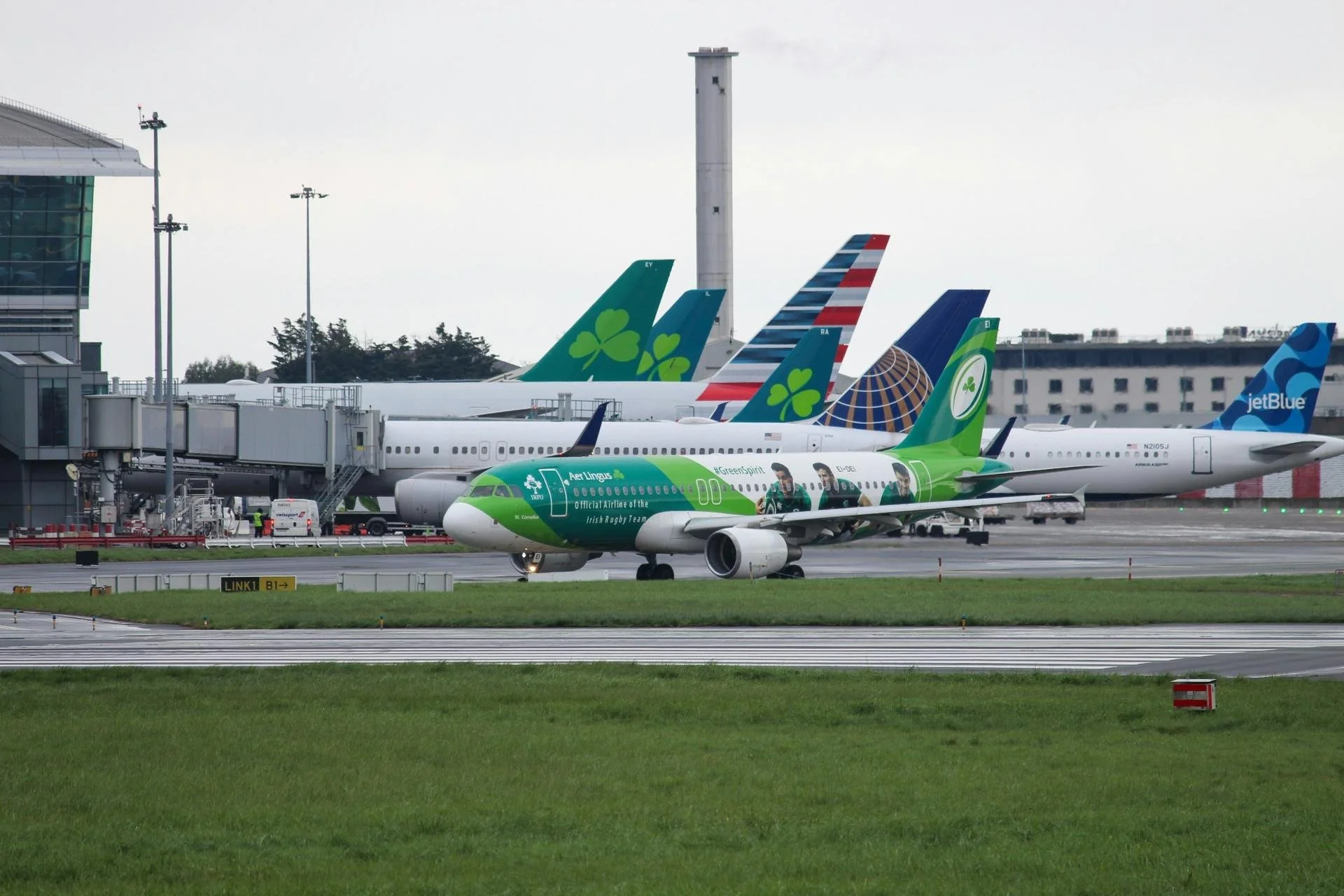 aer lingus planes on a tarmac outside of dublin airport