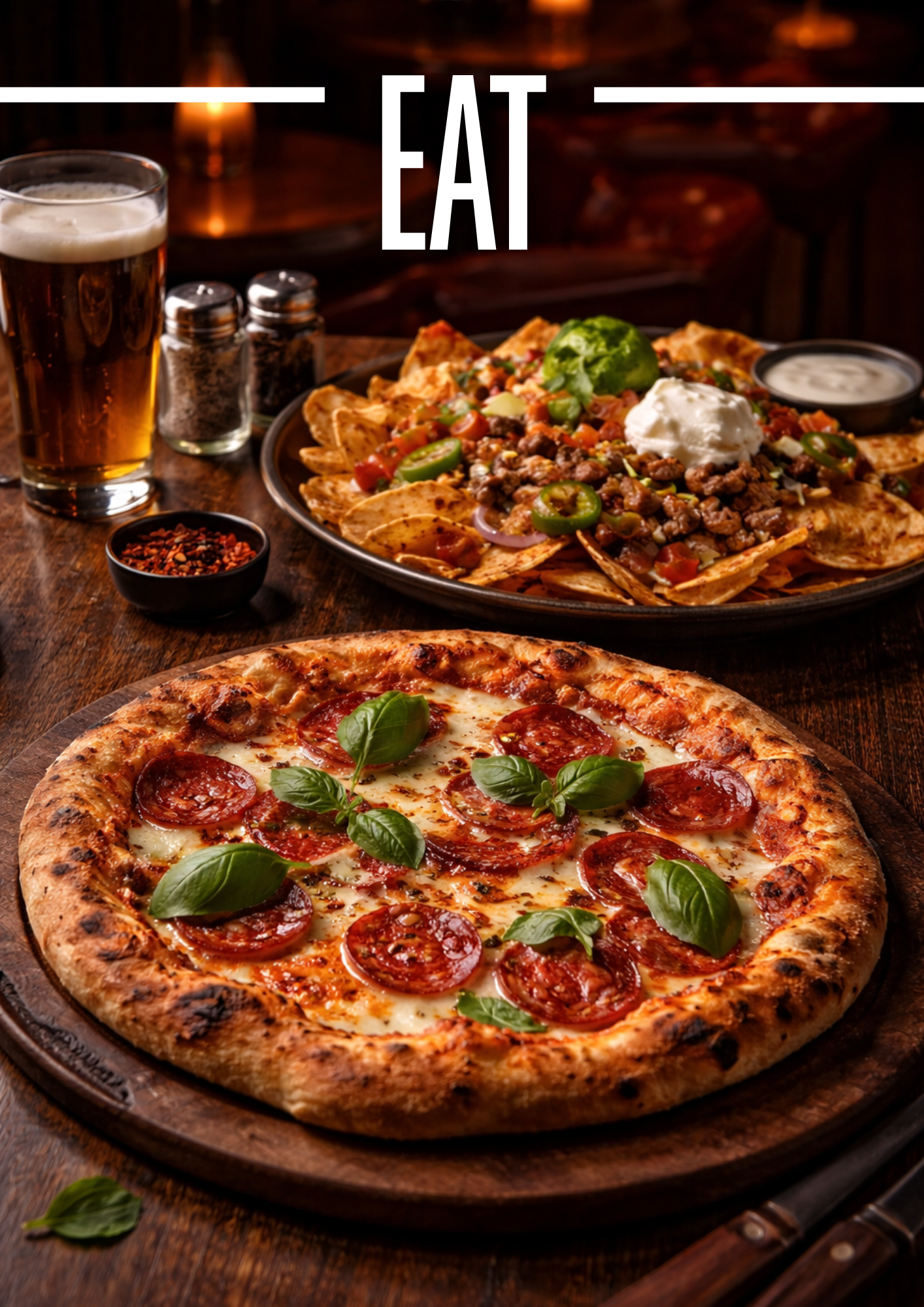 A classic pepperoni pizza with fresh basil, and a plate of Nachos topped with ground beef, cheese, jalapenos, sour cream, and guacamole. A glass of beer and condiments are on the wooden table.