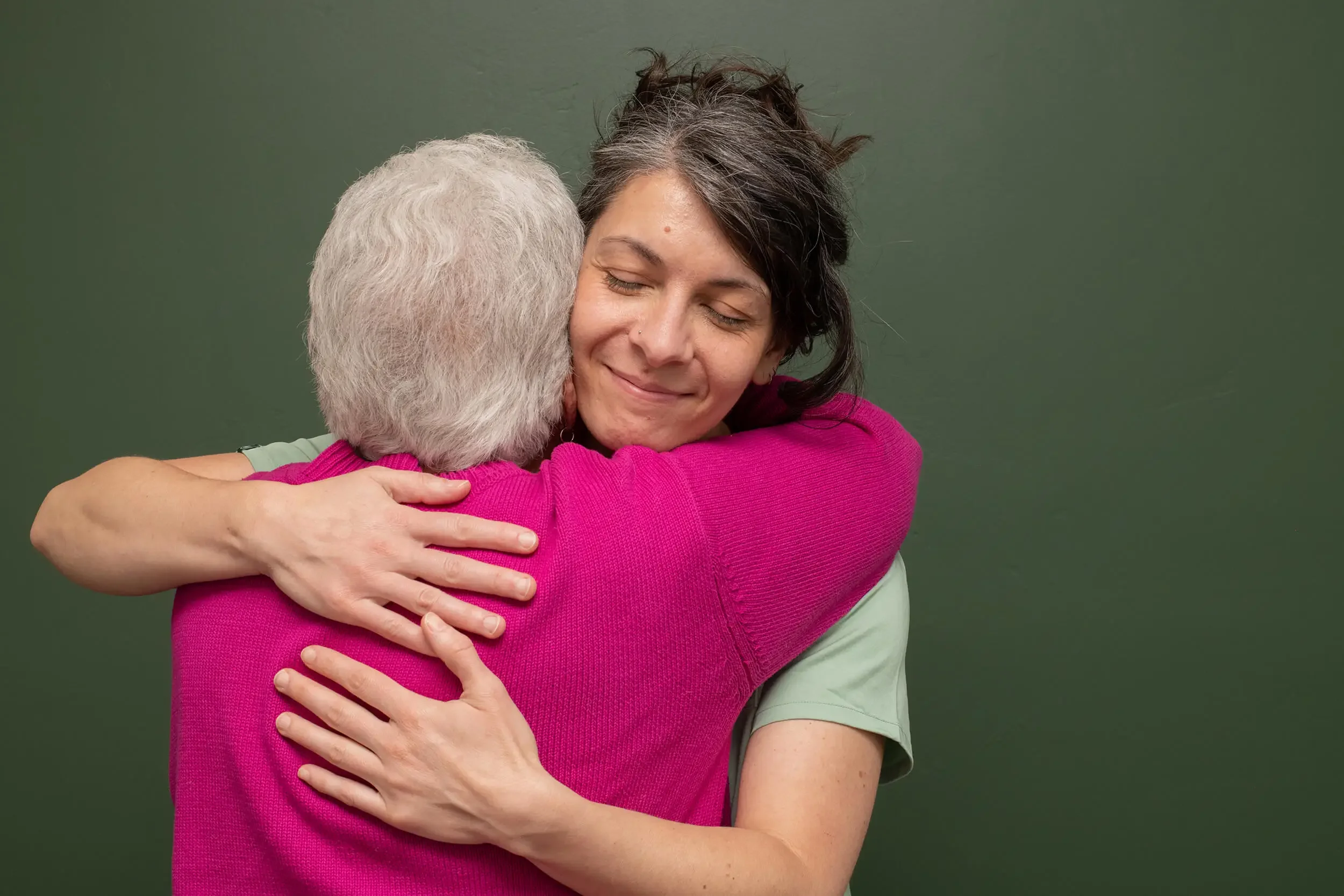 Mishe Skenderova, acupuncturist at Zelena Medicine in Basalt, Colorado hugging patient after functional medicine visit.