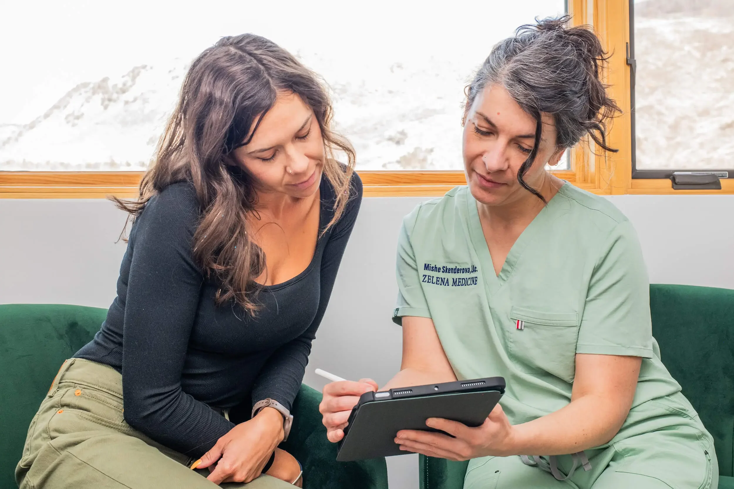 Mishe Skenderova, acupuncturist at Zelena Medicine in Basalt, Colorado during consultation with woman about health and functional medicine.