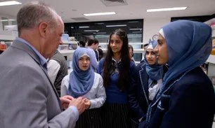 Interns discussing nanomedicine with Prof Colin Dunstan