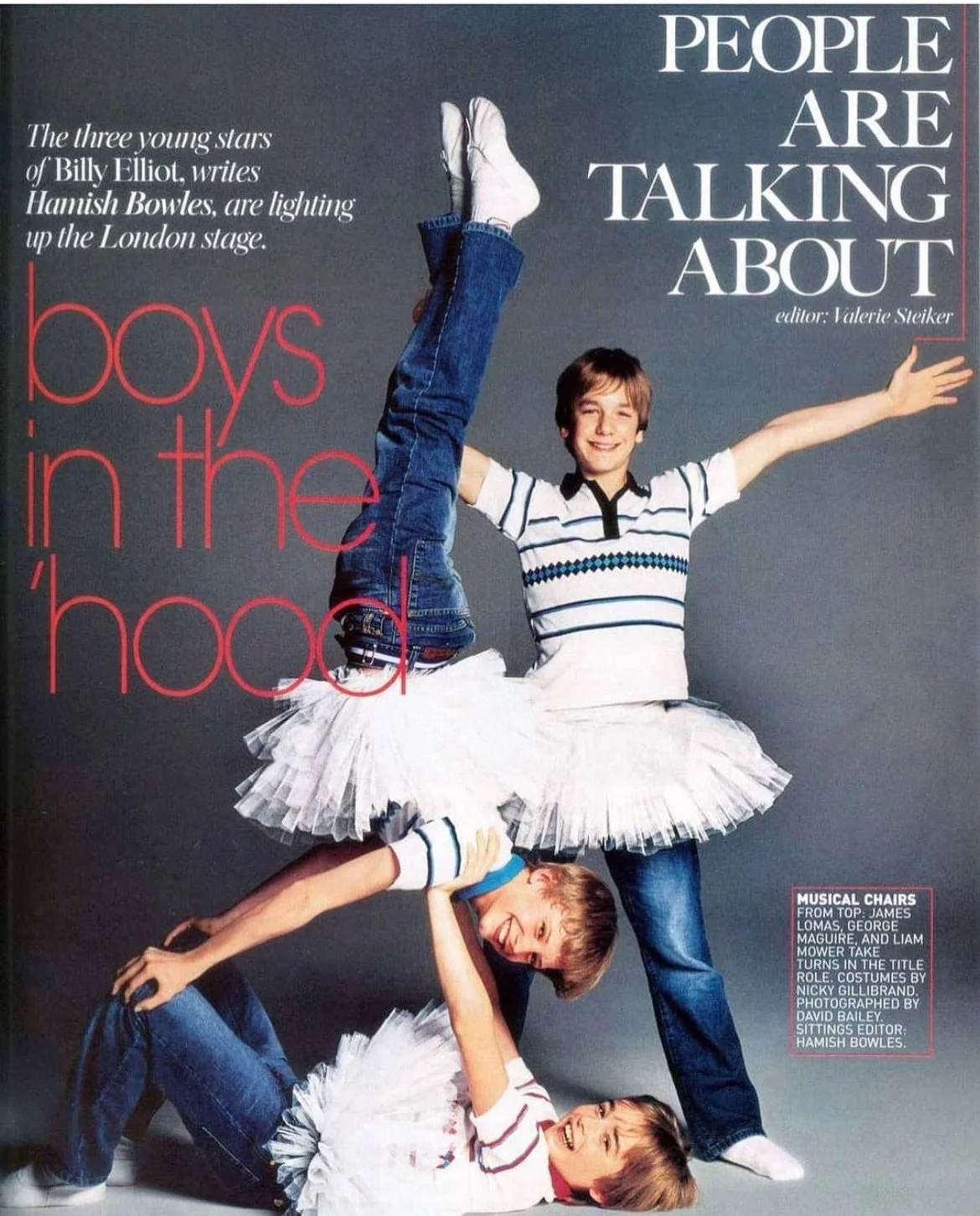 Photo of a young man and two children performing a dance pose, with the children wearing white tutus and striped shirts, against a plain background. The image is related to a magazine article about boys in the 'hood.