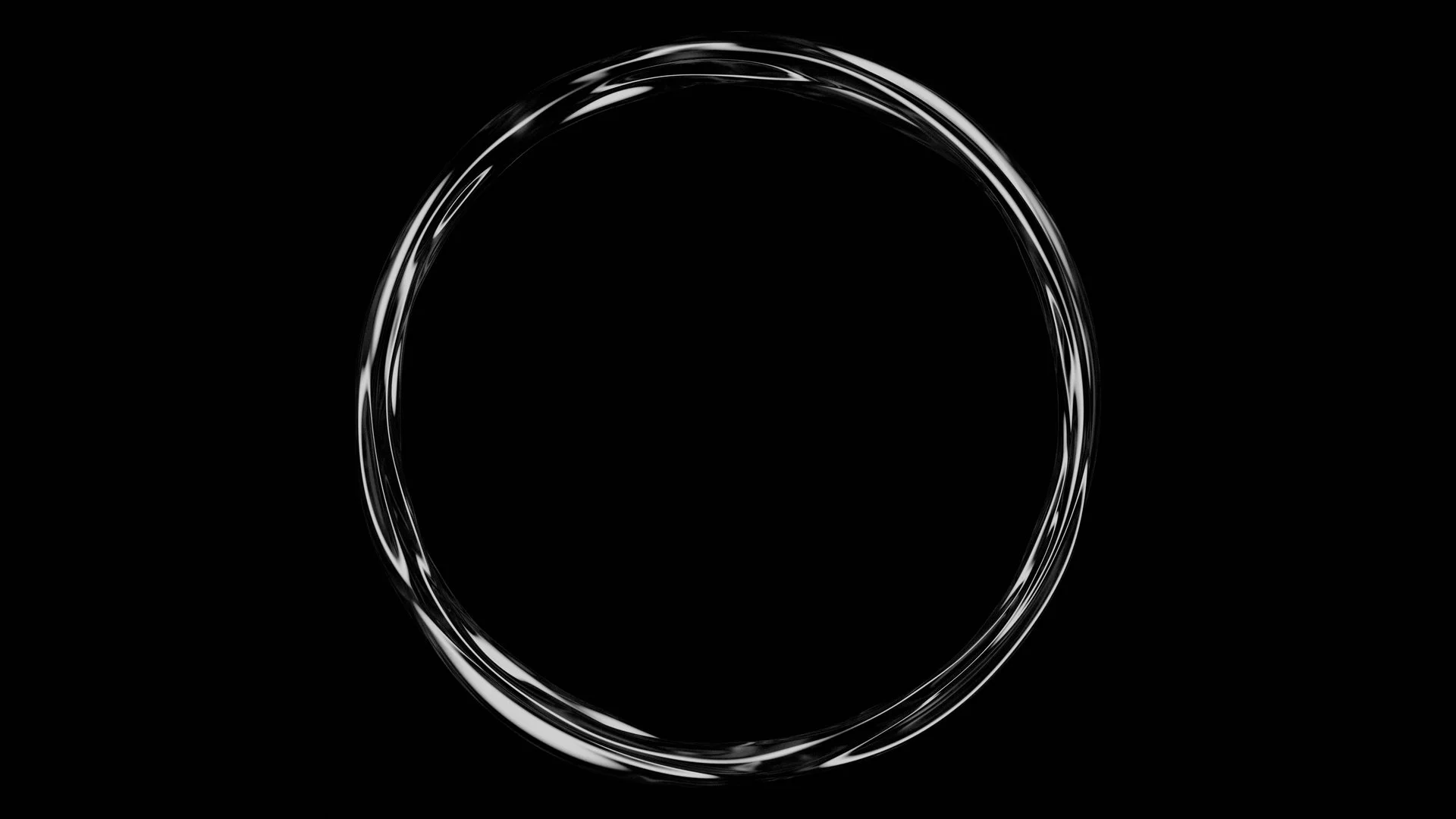 Silver metallic ring on a black background.