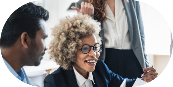 Project manager standing in an office, overseeing work