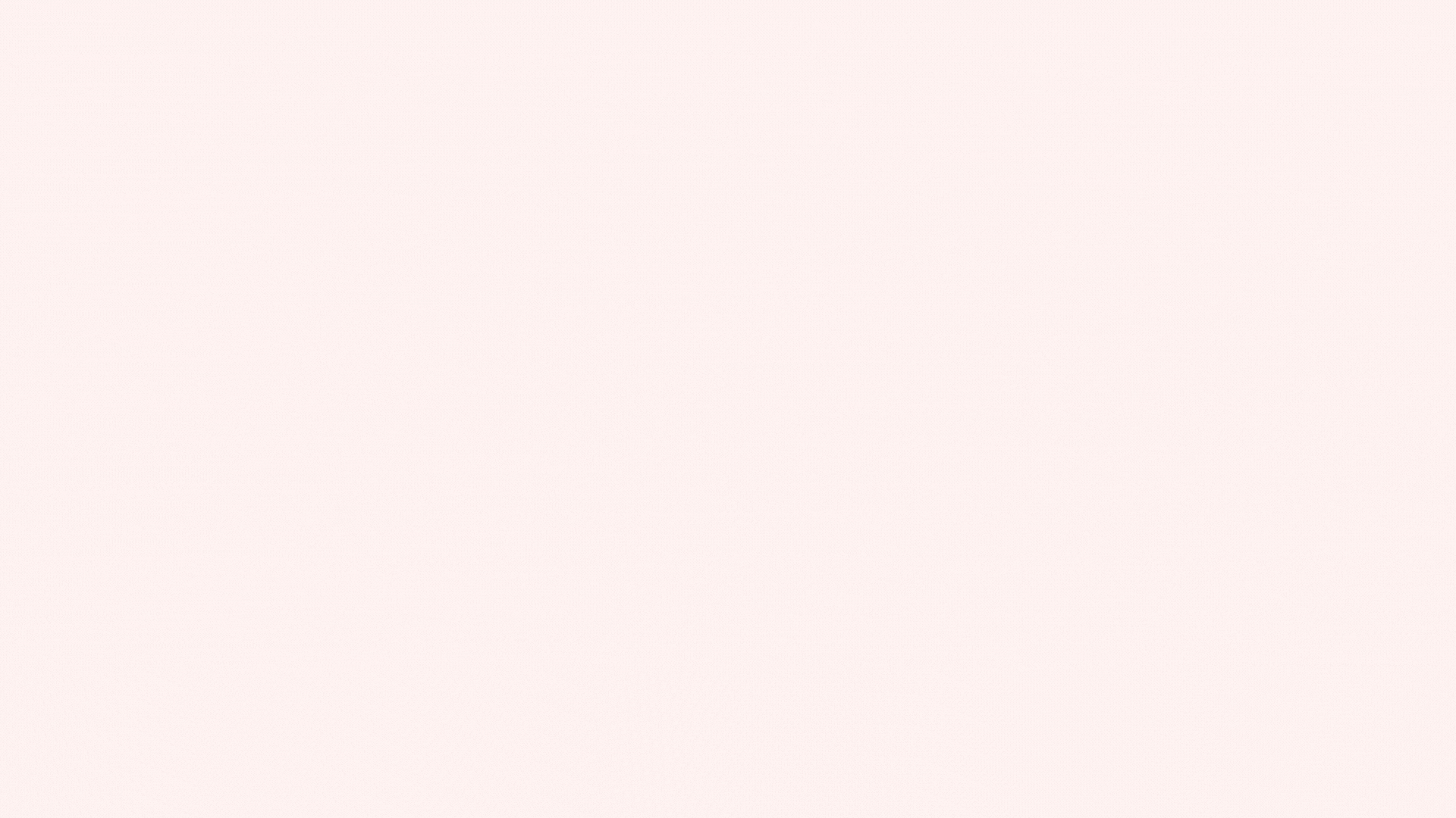 A blank light pink background with no objects or visible features.