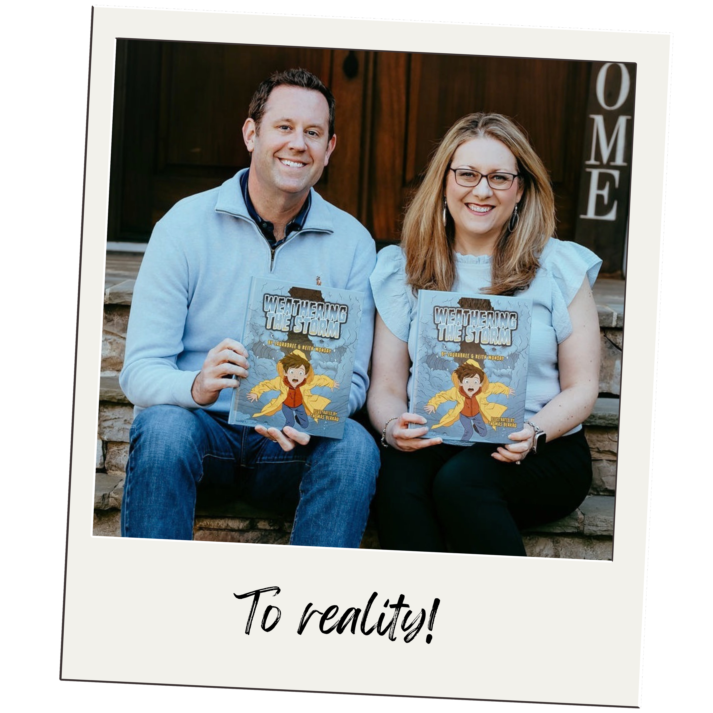 A man and woman sitting on a stone bench outdoors, holding a children's book titled "Weathering the Storm." The man has dark hair and is wearing a light blue zip-up sweater, and the woman has shoulder-length reddish-blonde hair, glasses, and is wearing a light blue blouse. Both are smiling and the setting appears to be near a wooden building with large letters spelling "HOME" in the background.