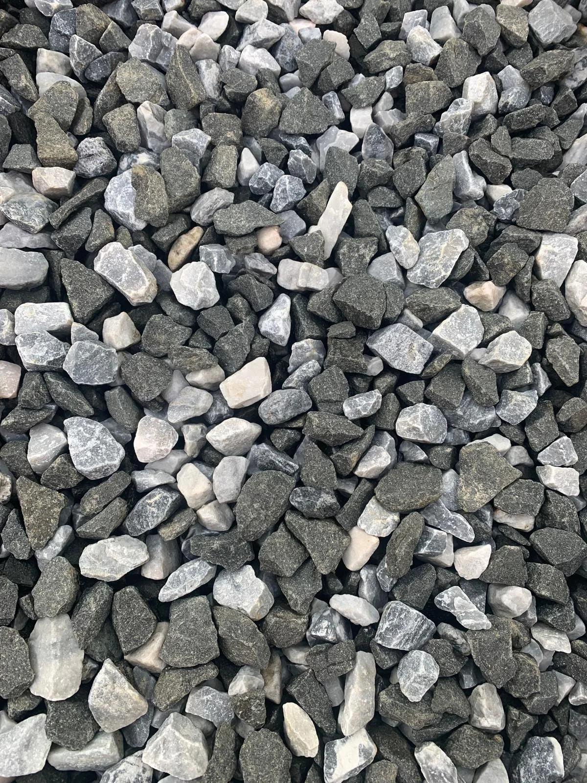 Close-up of small gray and white gravel stones.