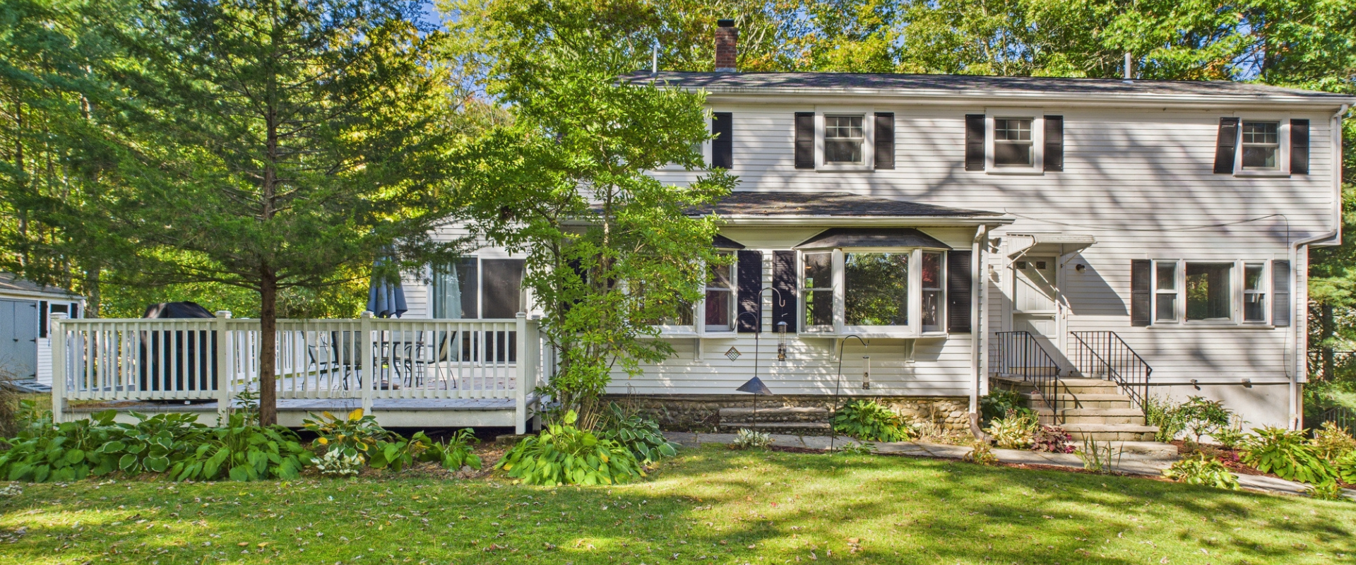 Two-story colonial home typical in Plymouth County Massachusetts neighborhoods where Pam Corning helps homeowners sell and rightsize.