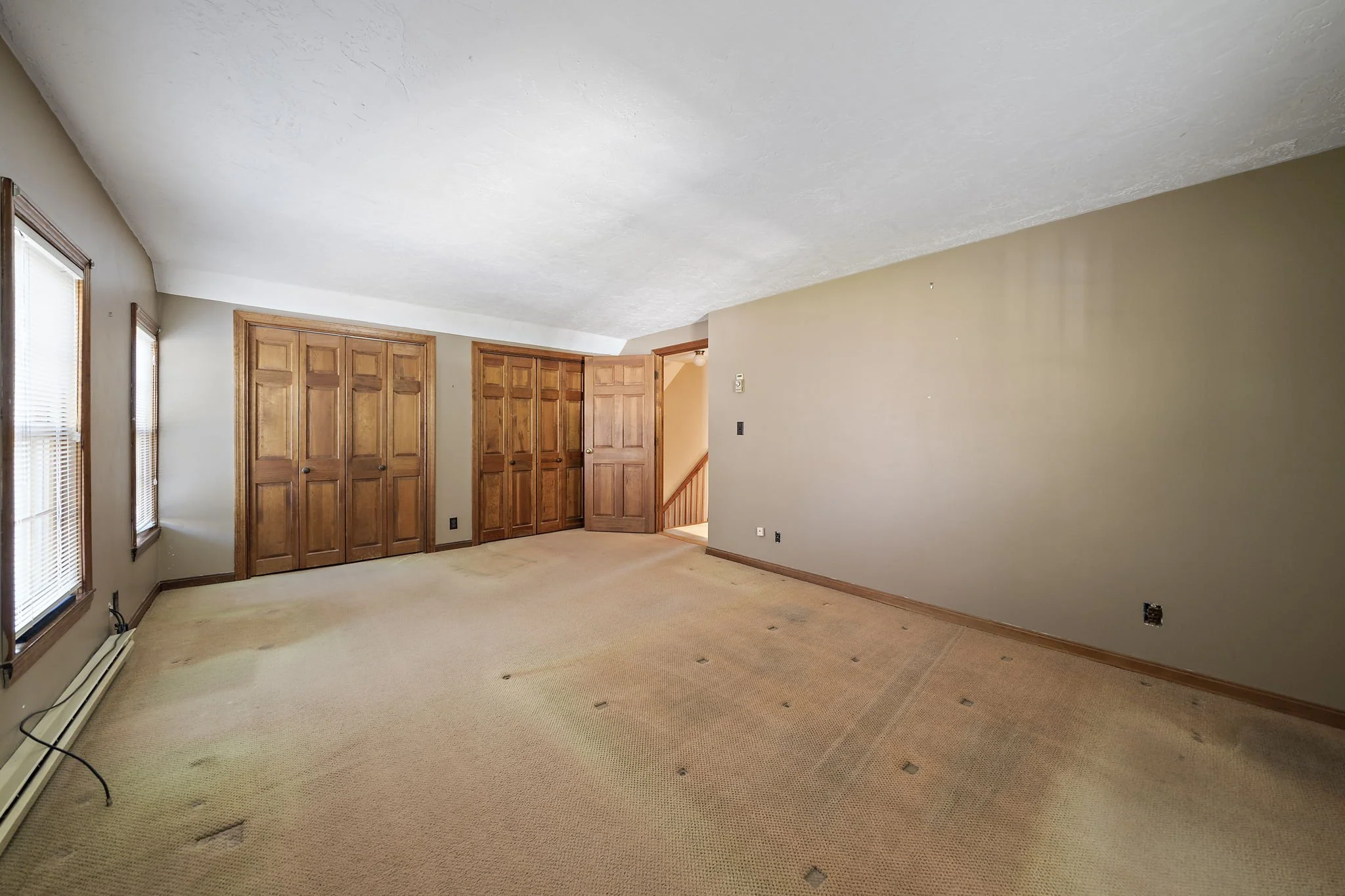 Spacious primary bedroom at Hanson MA home for sale