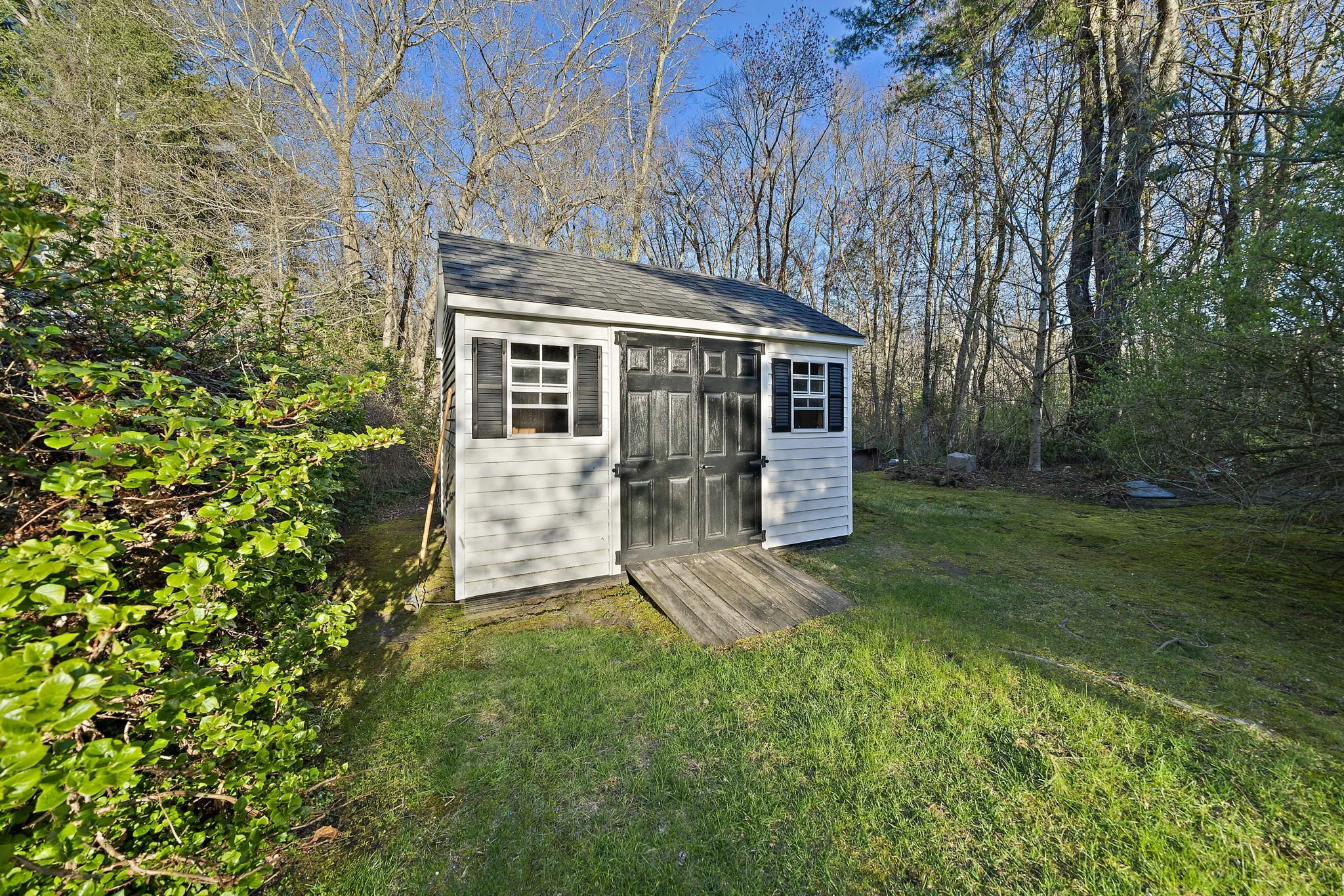 torage shed positioned on side of property at 63 Reed Street Hanson MA