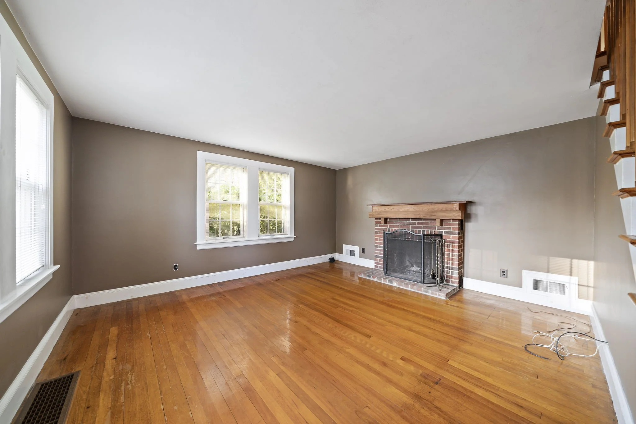 Living room with fireplace and hardwood floors at 63 Reed Street Hanson MA
