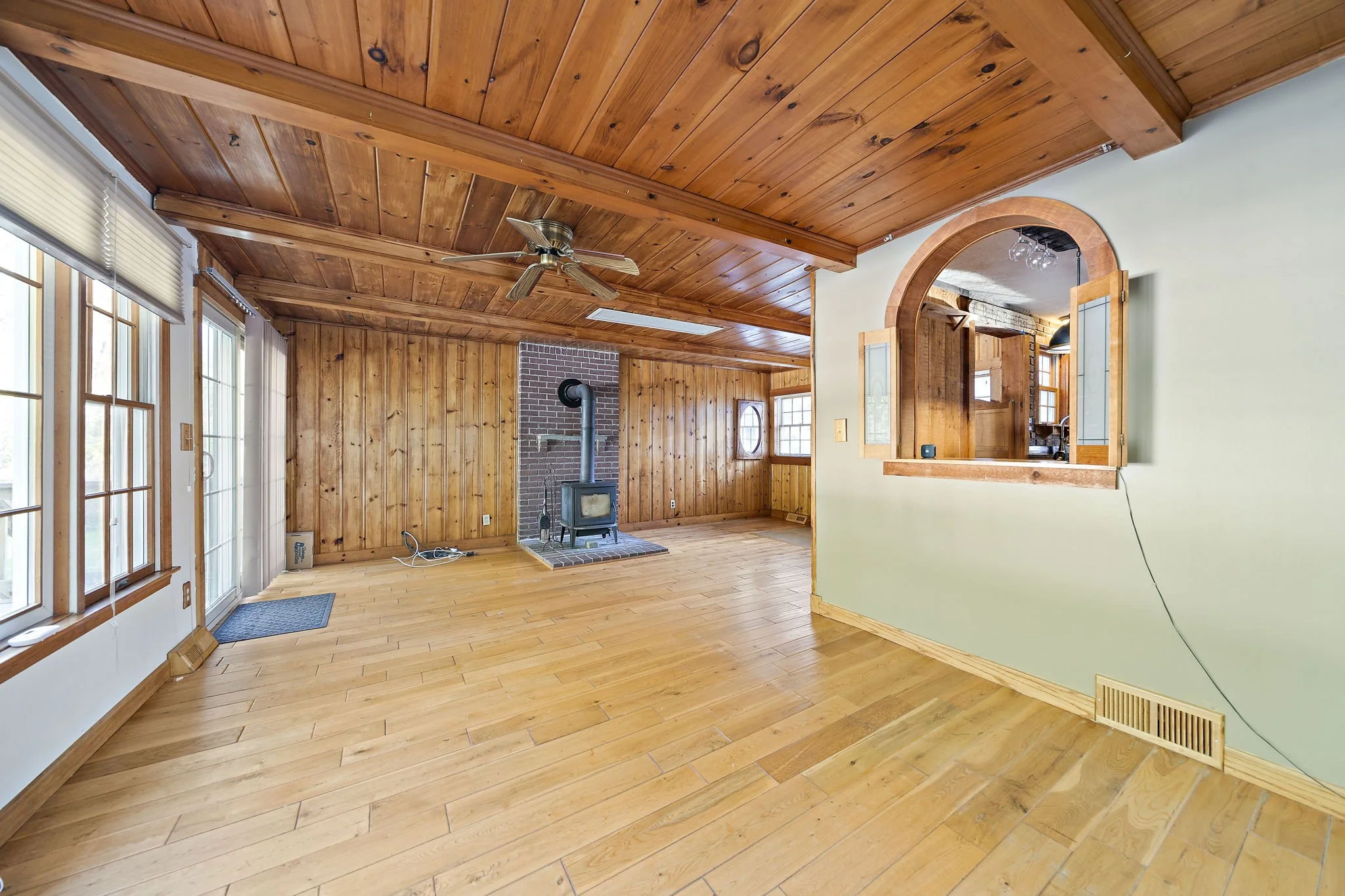 Breezeway sitting area with backyard views at 63 Reed Street Hanson MA