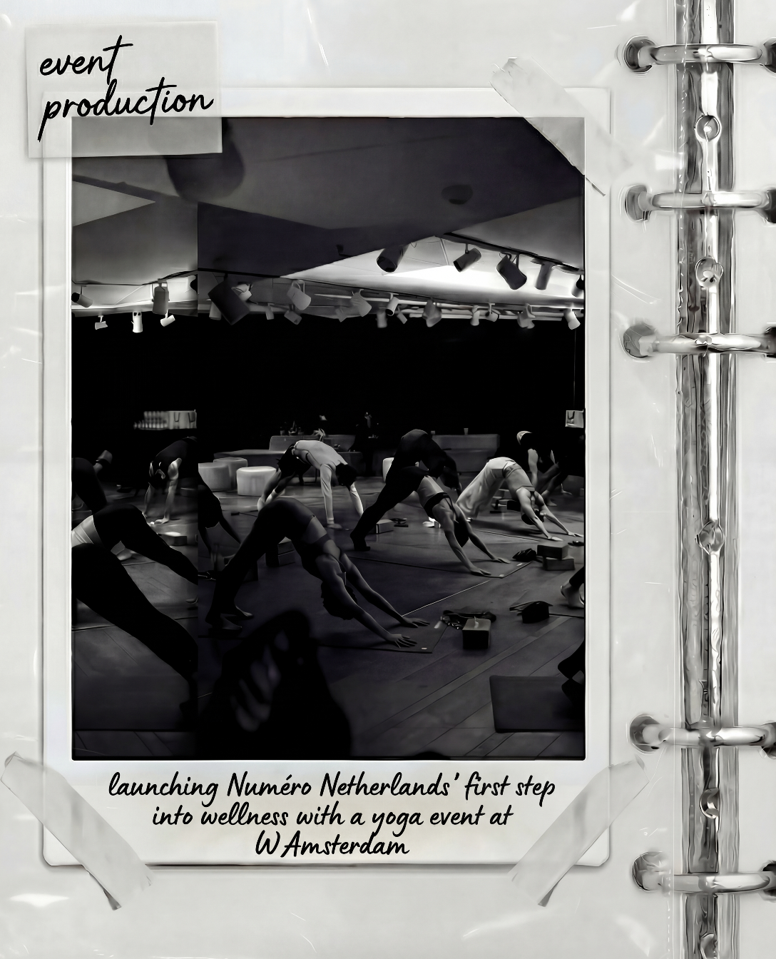 A group of people practicing yoga in a dark studio with a high ceiling, spotlights, and yoga mats, seen through a window with paper notes taped to the edges, with text indicating the launch of Número Netherlands' first wellness event in Amsterdam.