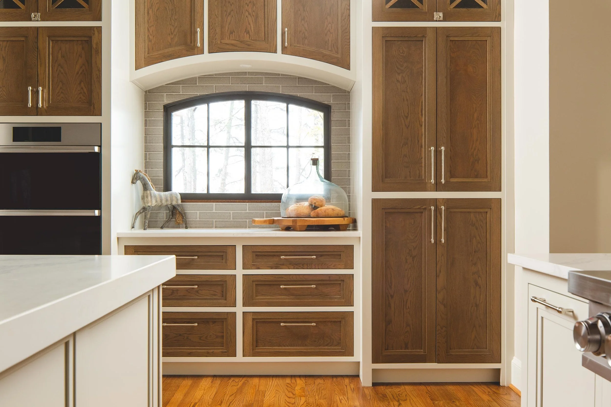 Two tone inset cabinetry stained oak doors, painted face-frames