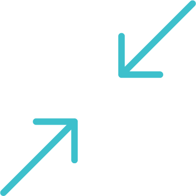 Person flipping through a sketchbook or color sample book on a wooden table with various ceramic and stone samples and a small terracotta dish.