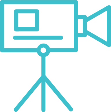 Someone flipping through a fabric sample book on a wooden table with various textured material samples and small dishes around.