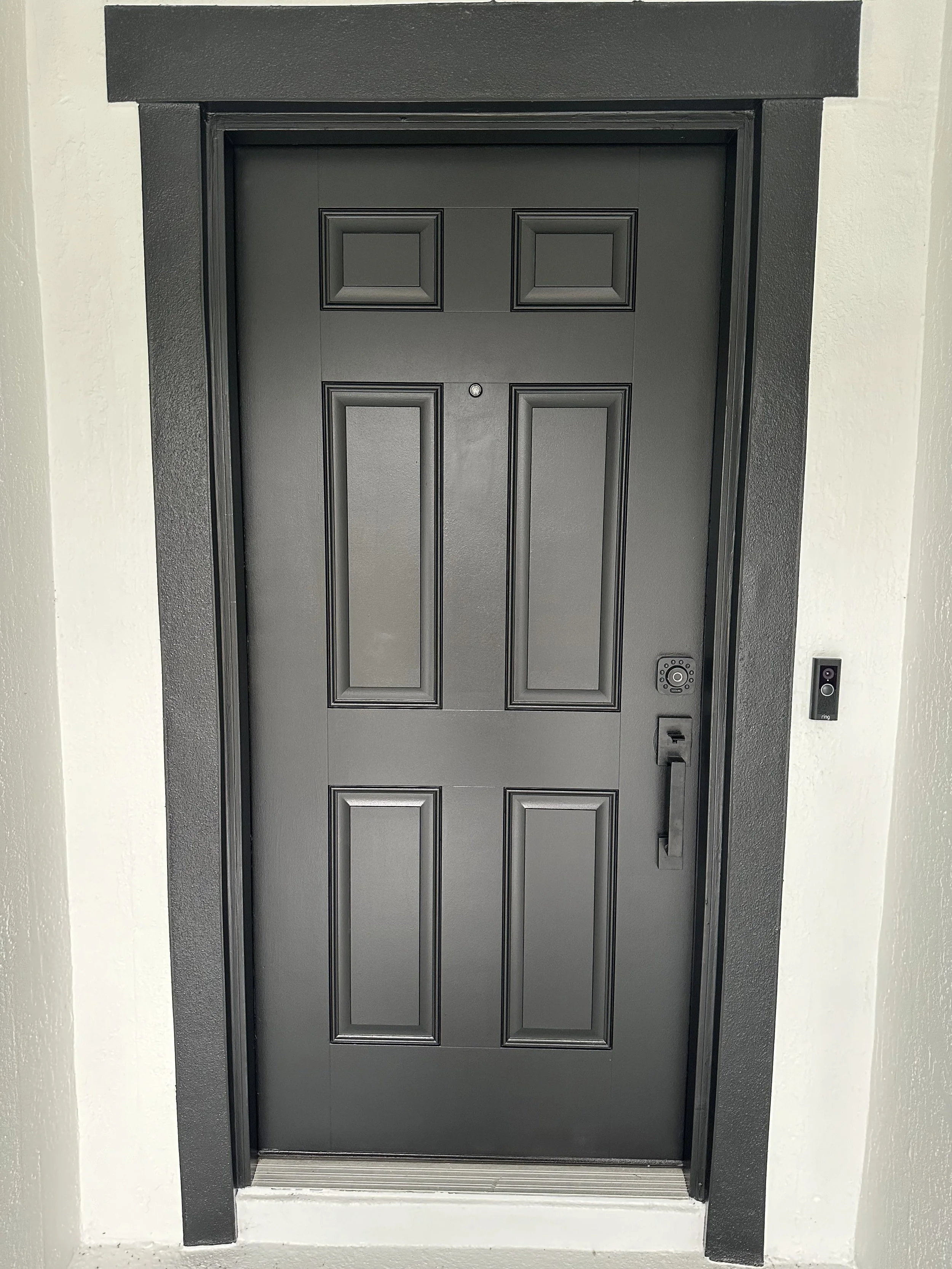 Bold new exterior door and trim painting In a house in Ormond Beach Florida we completed