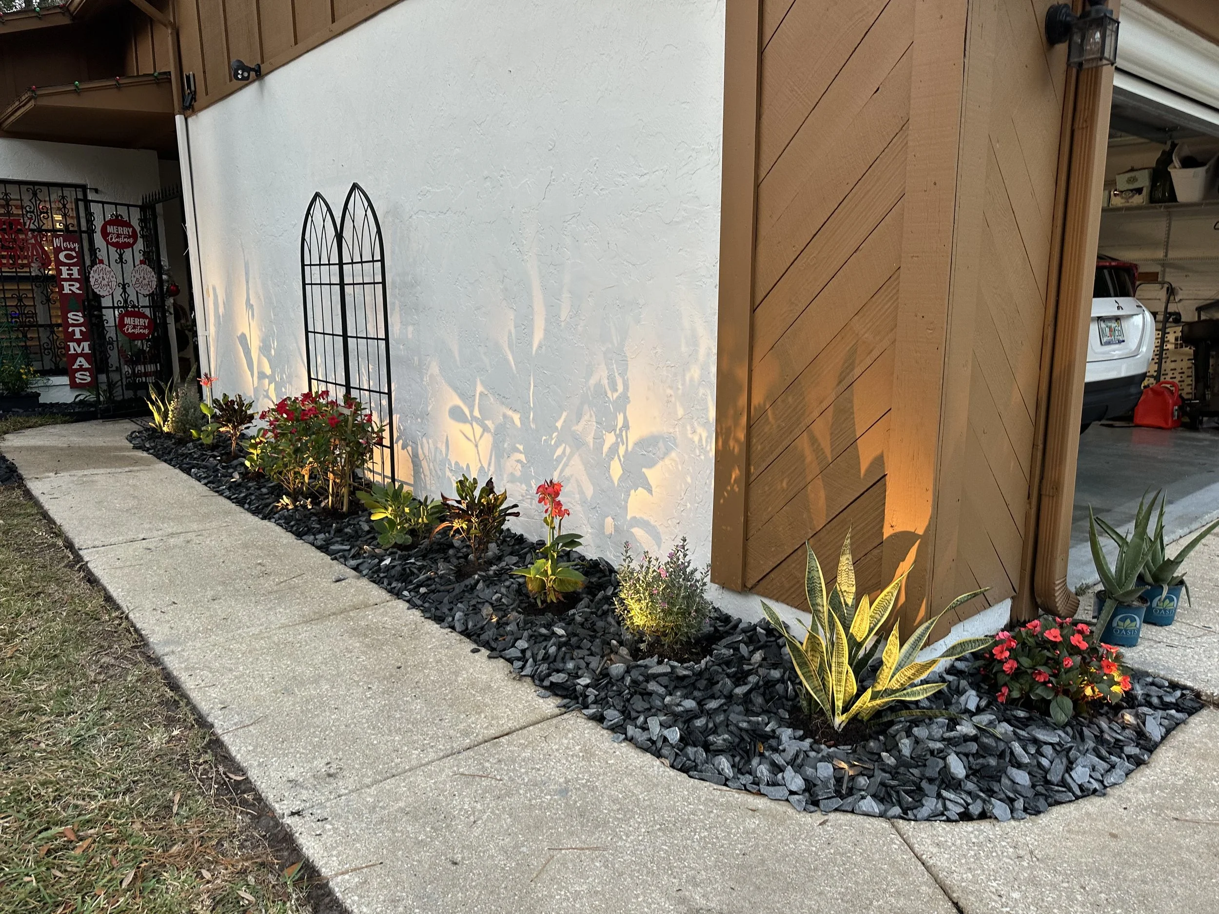 Complete landscape overhaul and with custom designed LED Low voltage landscape lighting with smartphone controls and lifetime materials warranty. WE completed this in 2024 in Ormond Beach Florida 