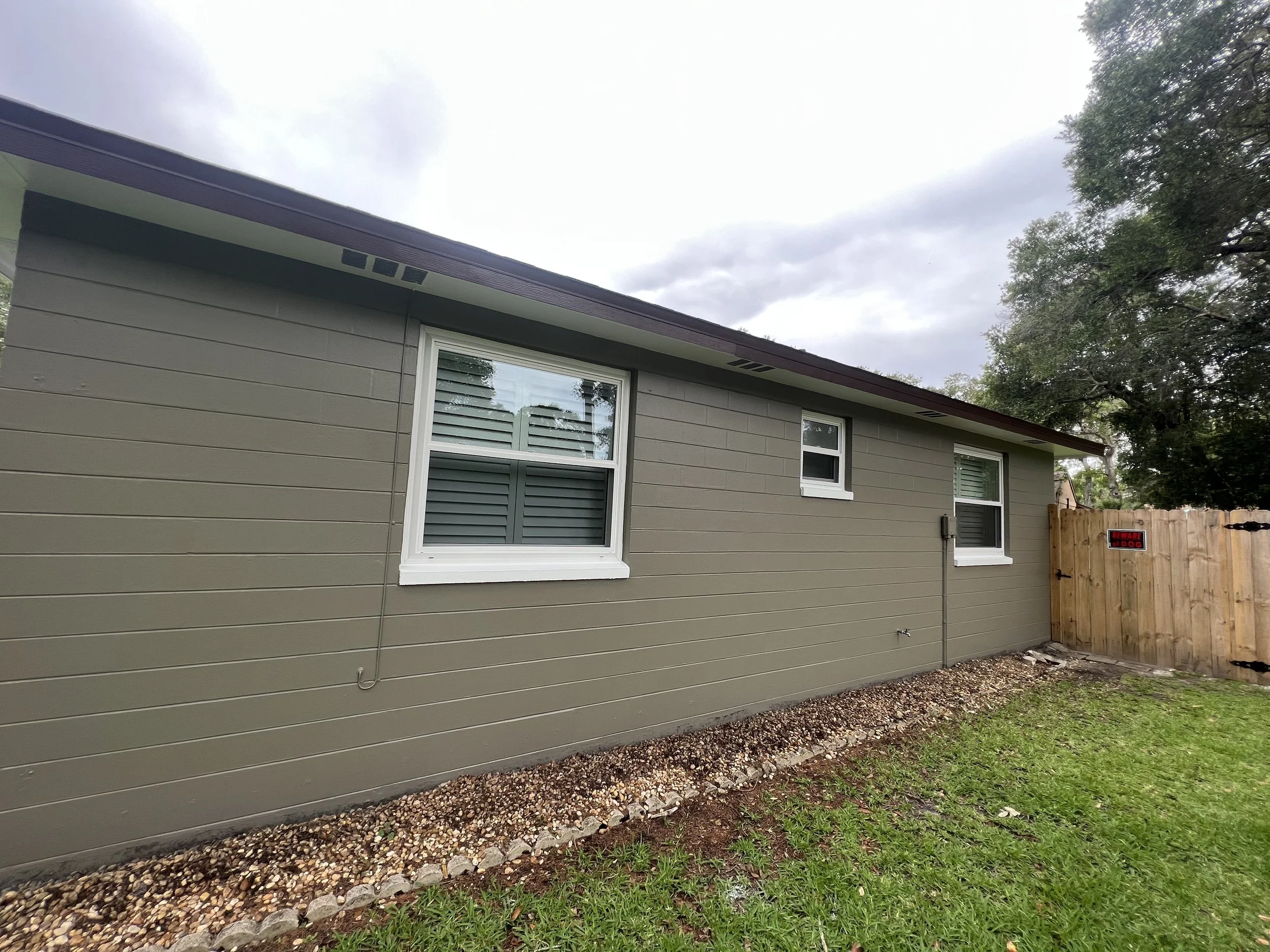 Exterior Painting of a Ormond Beach Block Home. Quality Products Sherwin Williams used and proper preparations and masonry sealer