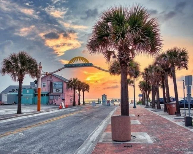 Sunset over a coastal street  FLAGLER AVENUE in the City of New Smyrna Beach, Florida an area we work and service in.