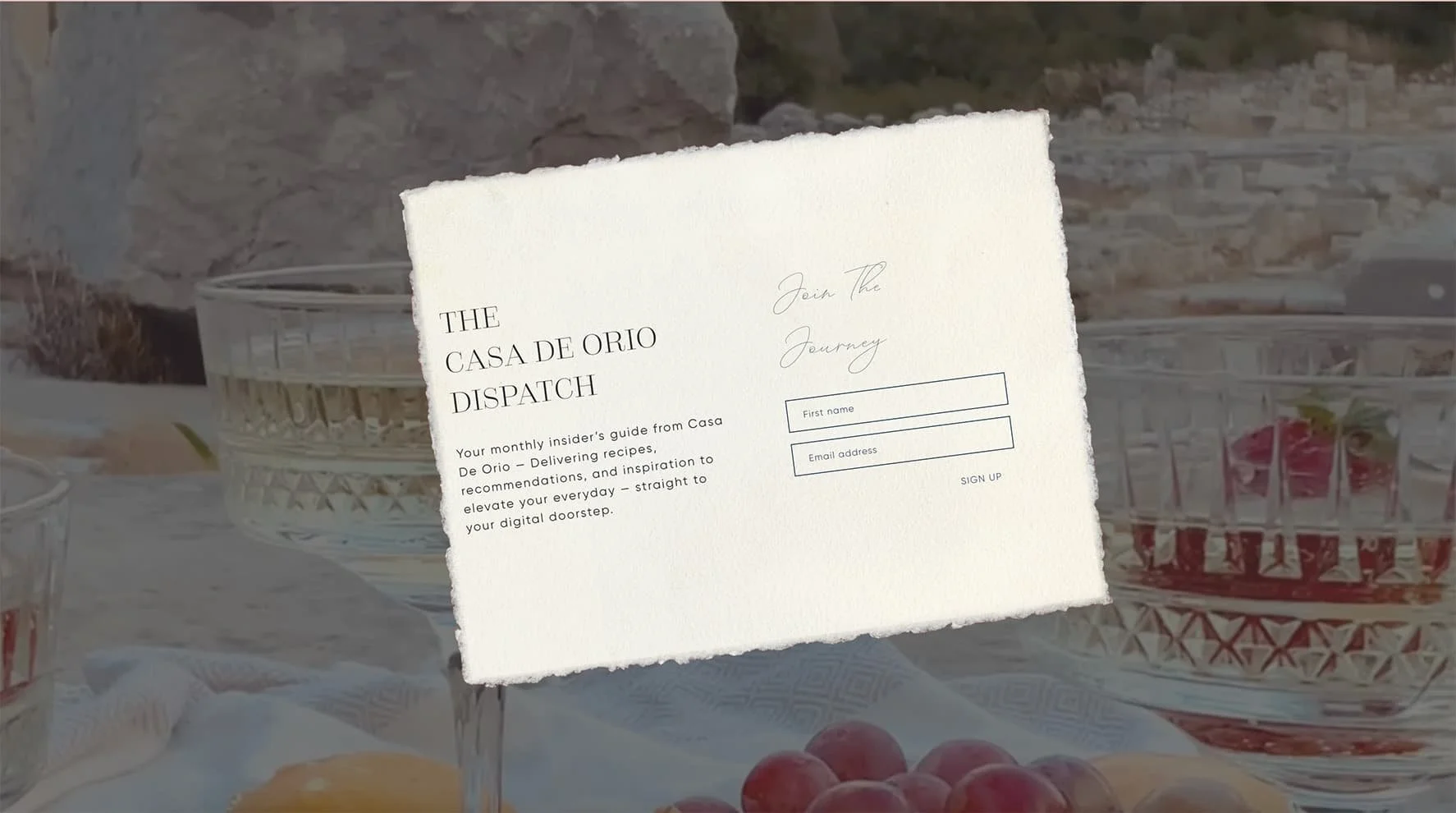 Elegant newsletter signup overlay with background of an outdoor table setting
